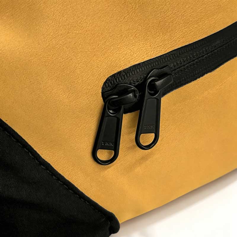 YKK dual-slider laminated zipper detail on the SL-E1176 backpack