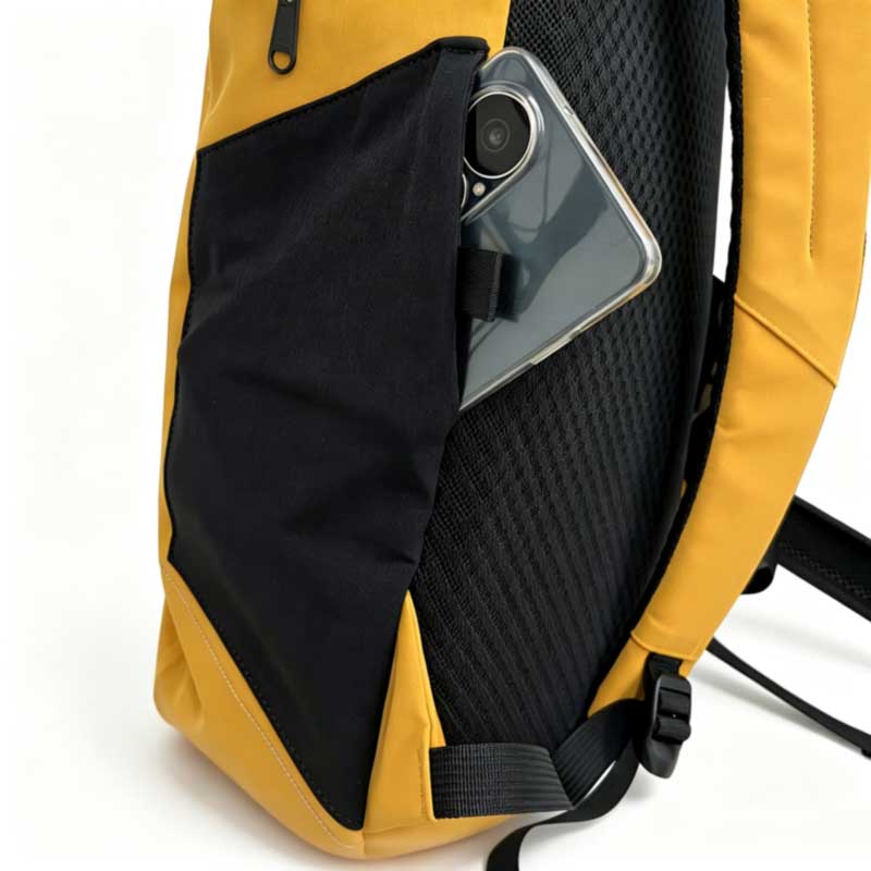 Hidden soft side pocket on the SL-E1176 backpack holding a phone